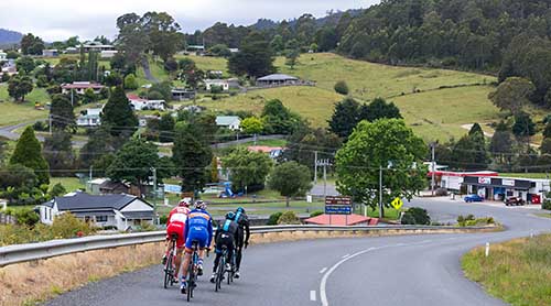 Road cyclists riding into Branxholm, North East Tasmania