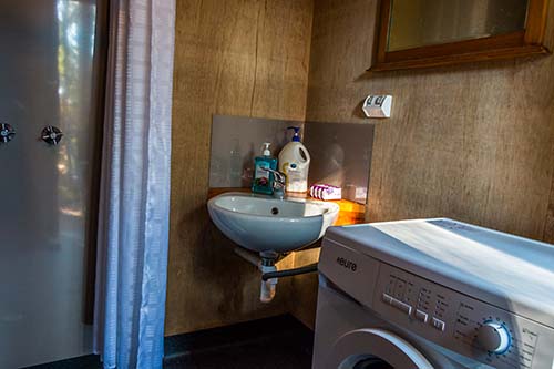 Corner of the bathroom showing the wash basin